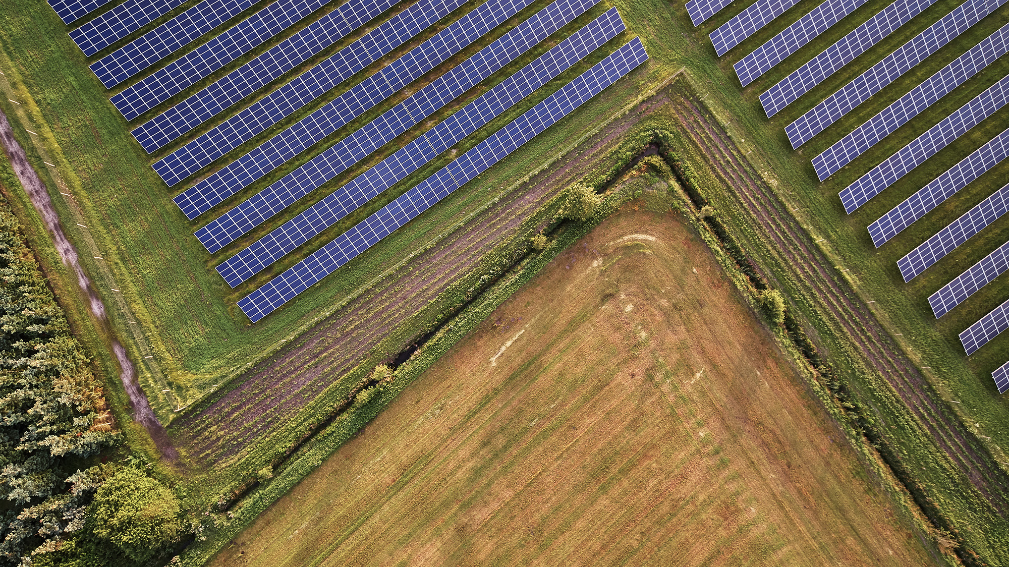 Drone image of a solar park near agricultural land