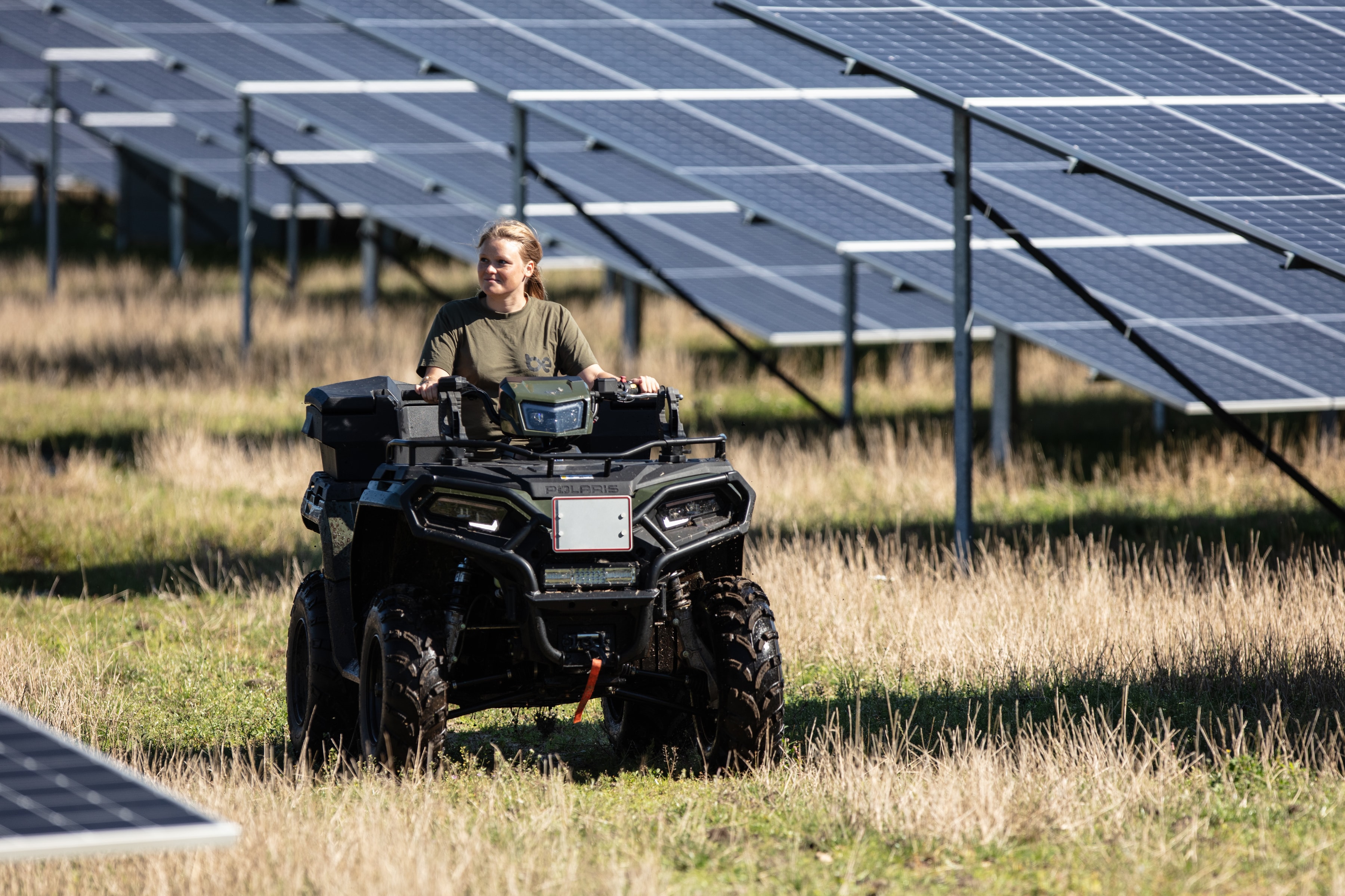 Person riding an ATV in a solar park
